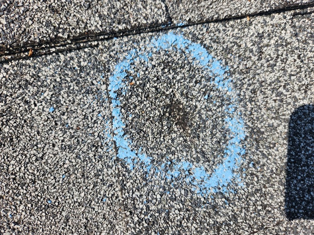 damage-circular-hit-on-shingle