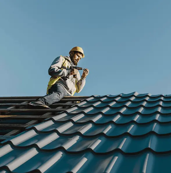 man working on roof